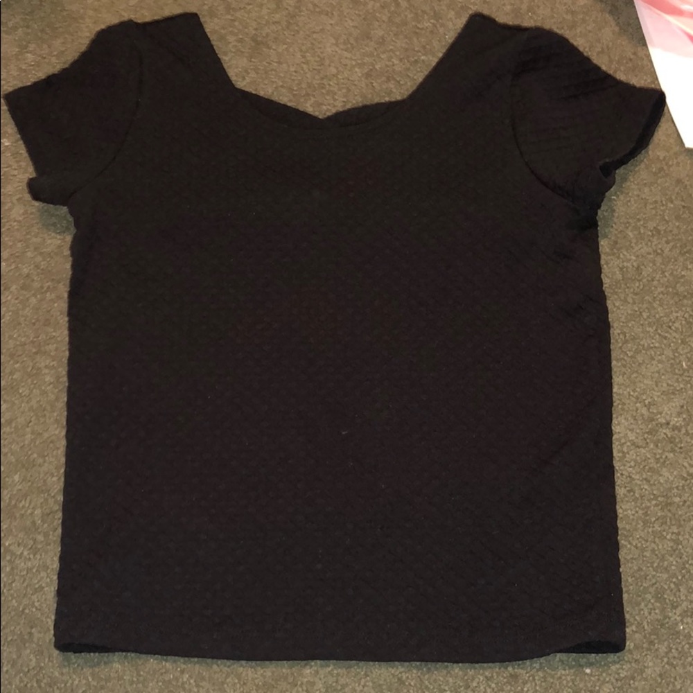 Black kids shirt with cross cut in back